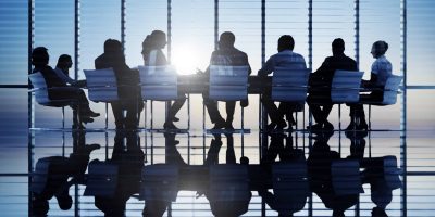 Silhouettes,Of,Business,People,In,A,Conference,Room.